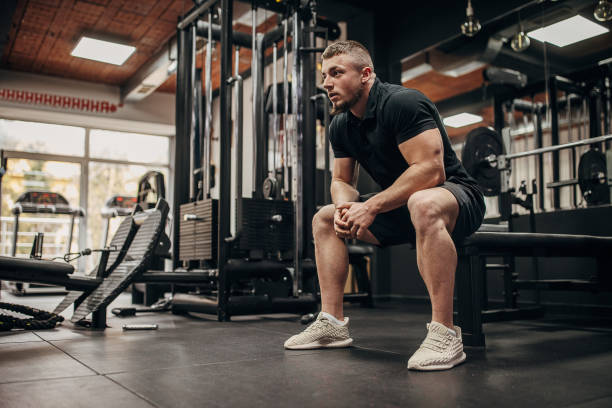 istock Man sitting in gym 1388958357