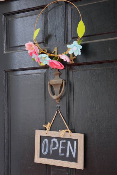 istock Open Sign and Wreath on Front Door 1388962287