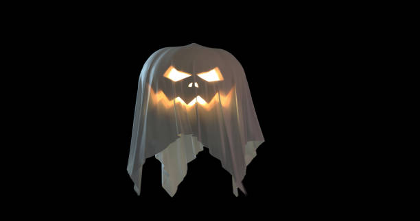 A scary Jack'O lantern with glowing eyes and mouth covered with a white sheet levitating on a black background with a copy space