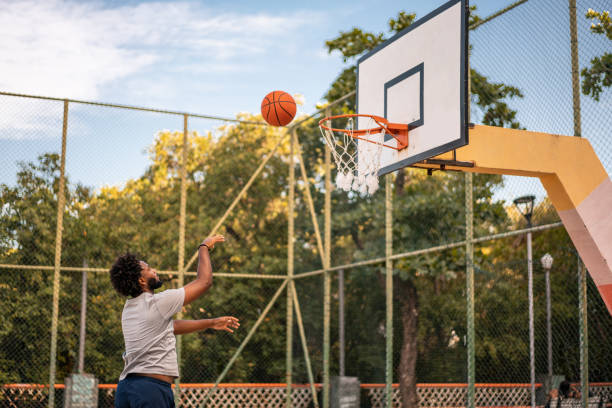istock Player throwing the basketball into the hoop 1388965681
