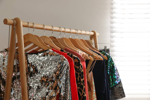 istock Rack with stylish women's clothes indoors. Interior design 1388967611