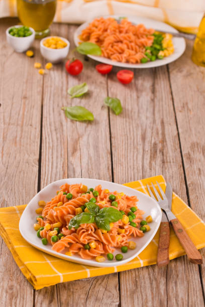 istock Fusilli pasta with peas and sweet corn. 1388969002