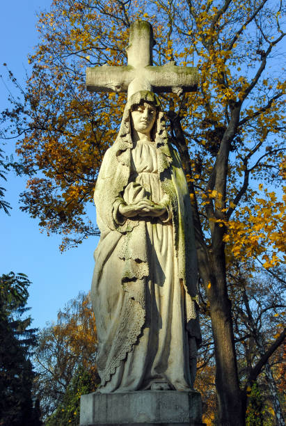 istock Tombstone, Woman with a Cross 1388970370