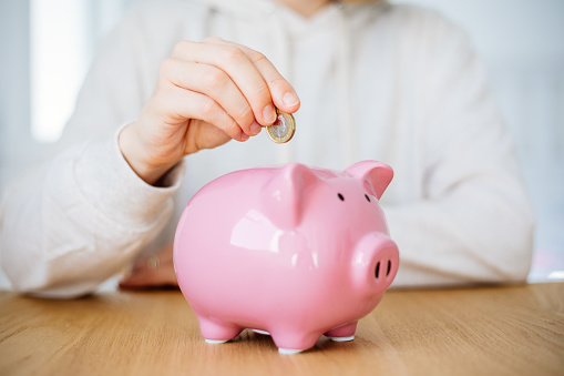 A close up to a isolated piggy bank on a white background.