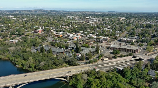 American River with bridges spanning over as it winds through Folsom, California.