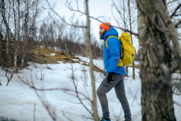 istock A side view of a millennial man who spends his day hiking. ISL 1388971732