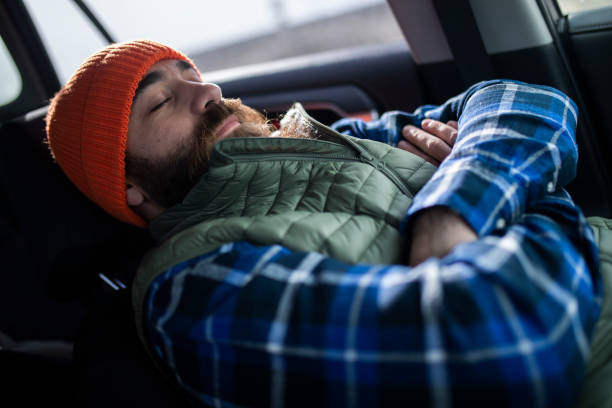 istock The mountaineer rests napping in his car. ISL 1388971802