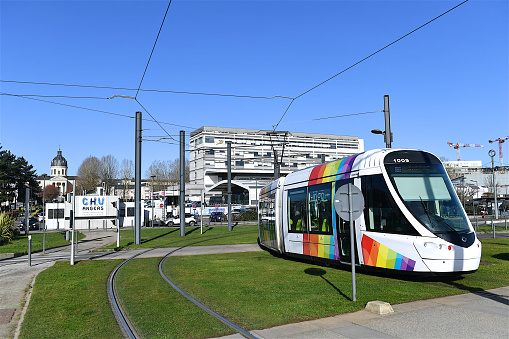 Angers, France-02 25 2022: Tramway passing near the Angers Hospital and medical buildings, France.