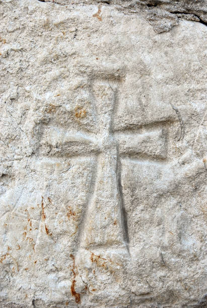 istock Cross carved in stone, Poland 1388977190