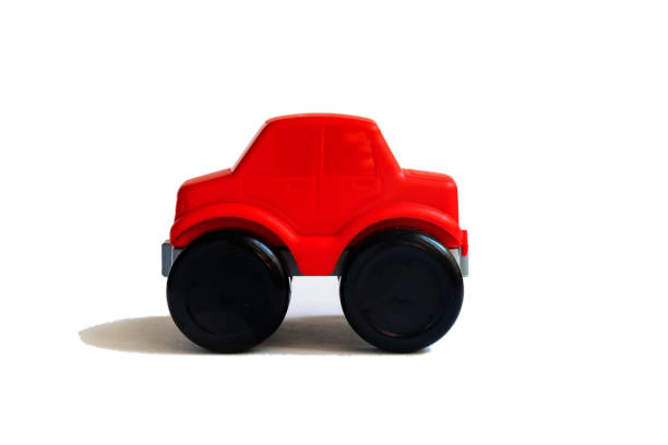 istock Children's red toy car on a white background. 1388980086