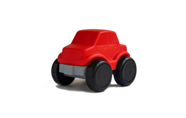istock Children's red toy car on a white background. 1388980090