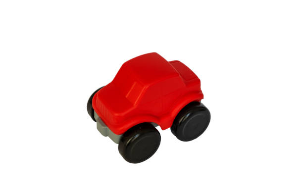 istock Children's red toy car on a white background. 1388980091