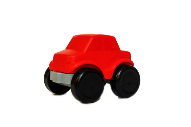 istock Children's red toy car on a white background. 1388980094