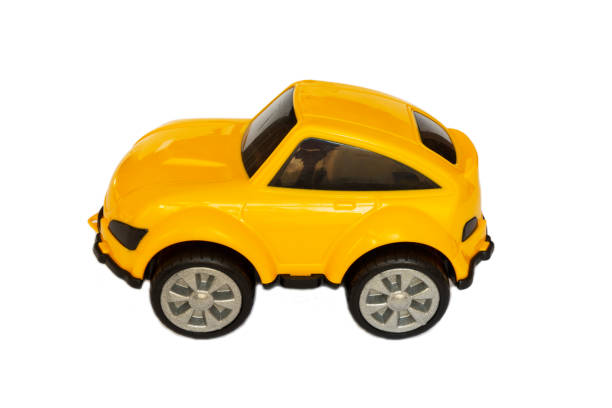 istock Children's yellow plastic toy car on a white background 1388980110