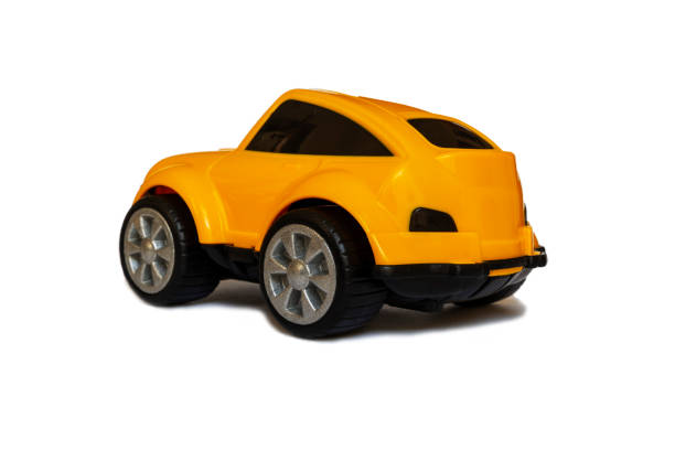 istock Children's yellow plastic toy car on a white background 1388980111