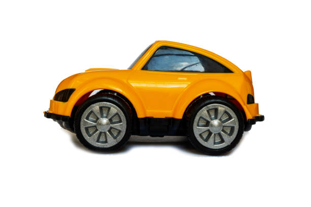 istock Children's yellow plastic toy car on a white background 1388980117