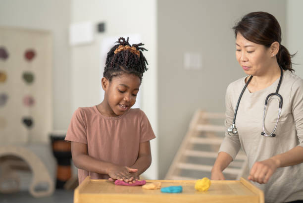 istock Little Girl in a Therapy Session 1388985622