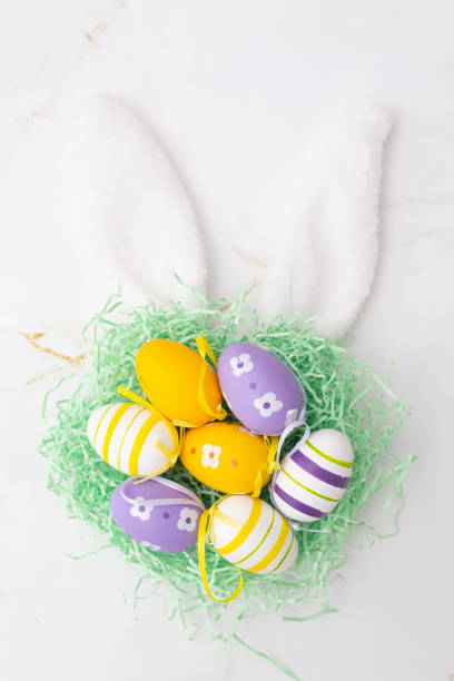 istock Easter eggs in the nest on rustic wooden background 1388987127