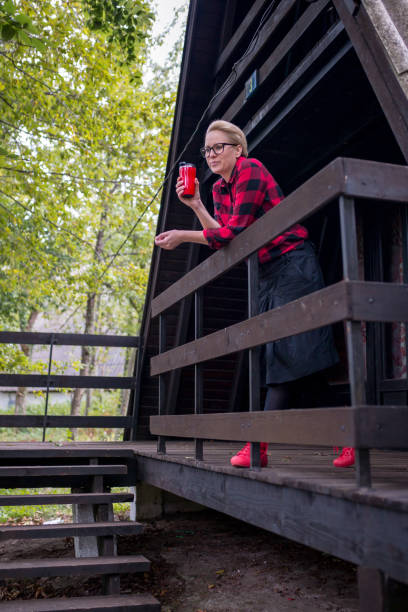 istock Woman standing on verandah 1388988288