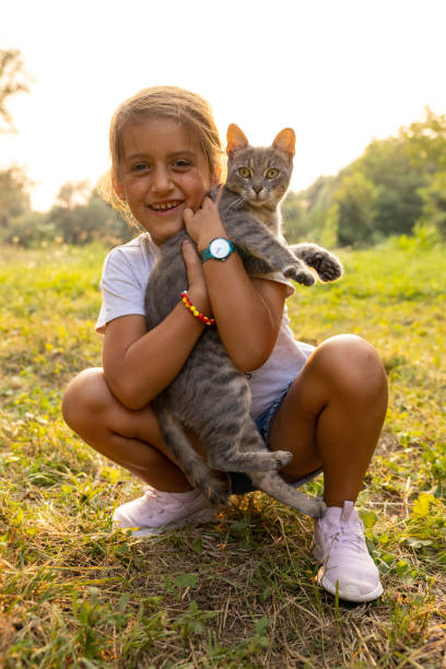 istock Joyful Caucasian girl holding her cat 1388989669