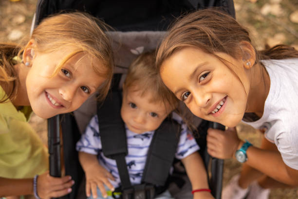 istock Cute Caucasian brother and sisters 1388991022