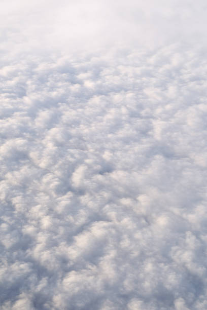 istock View of clouds from above. Heaven background. Clear cloudscape 1388991655
