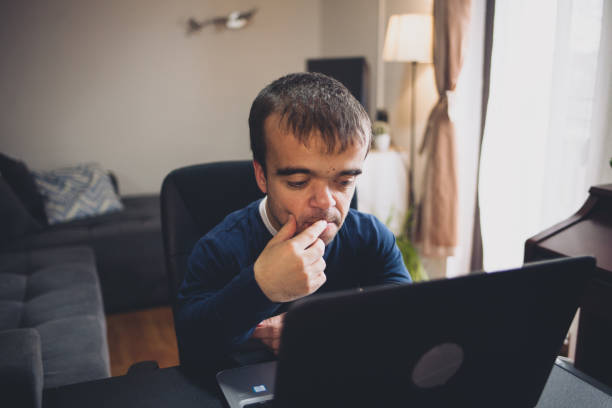 Young man with dwarfism working from home Serbia, 30-34 Years, Achondroplasia, Adult, Adults Only dwarf stock pictures, royalty-free photos & images