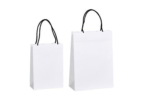 Two different sized white cardboard bags with black cord on white background