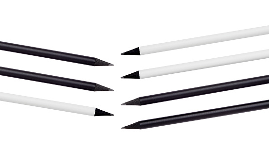 Seven pencils, black and white, on white background