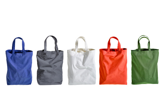 Colorul cotton bags in a row on white background