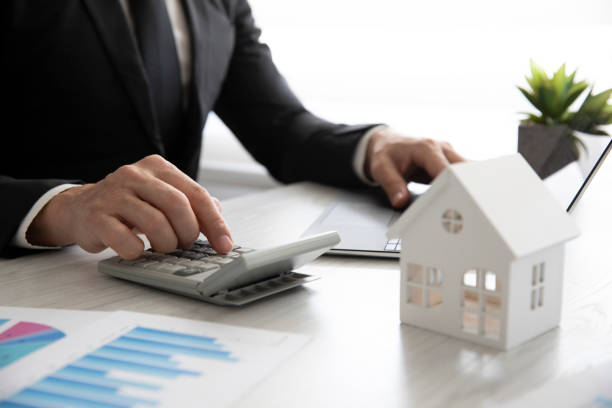 istock Mortgage Concept with Businessman 1388998517