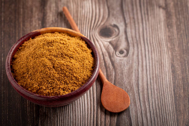 istock Brown sugar in wooden bowl on the table. 1389005362