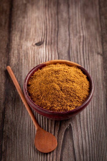 istock Brown sugar in wooden bowl on the table. 1389005363