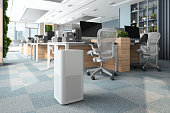 istock Air Purifier In Modern Open Plan Office For Fresh Air And Healthy Life 1389005386