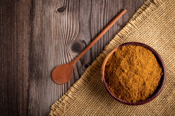 istock Brown sugar in wooden bowl on the table. 1389005434