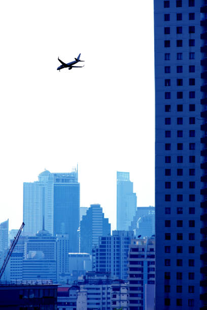 Free Stock Photo of Airplane Flying Over Building With Sky Background ...