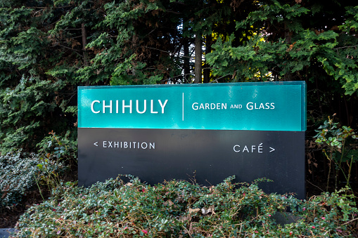 Seattle, WA USA - circa March 2022: Angled view of the entrance sign for Chihuly Garden in the downtown area near the Space Needle.