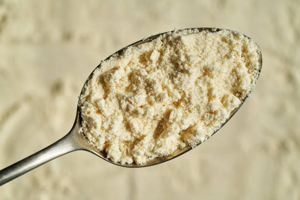 istock Whey protein powder on a spoon, top view 1389010498