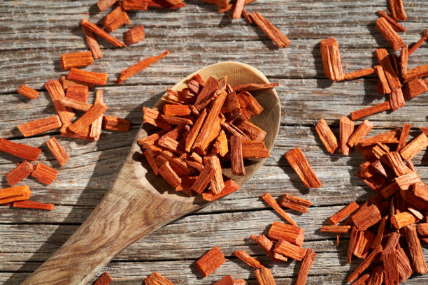 istock Red sandalwood chips on a wooden table 1389012436