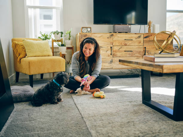 istock Woman at Home With Her Pet Dog 1389012611