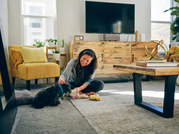 istock Woman at Home With Her Pet Dog 1389012632