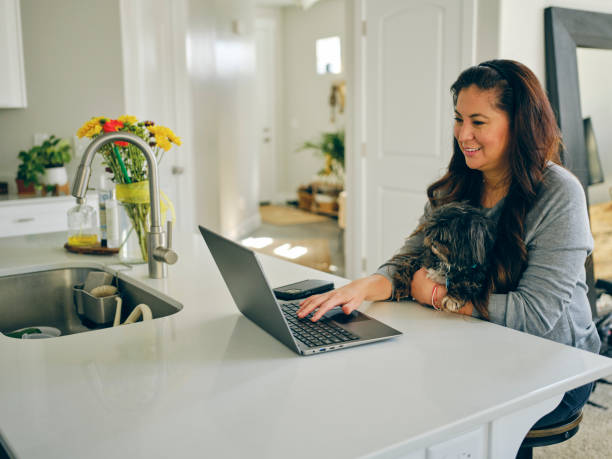 istock Woman at Home With Her Pet Dog 1389012671