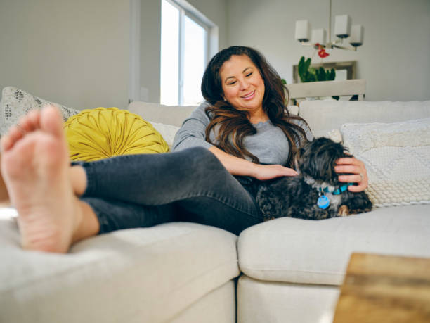 istock Woman at Home With Her Pet Dog 1389012686
