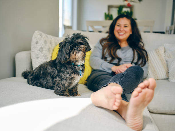 istock Woman at Home With Her Pet Dog 1389012695