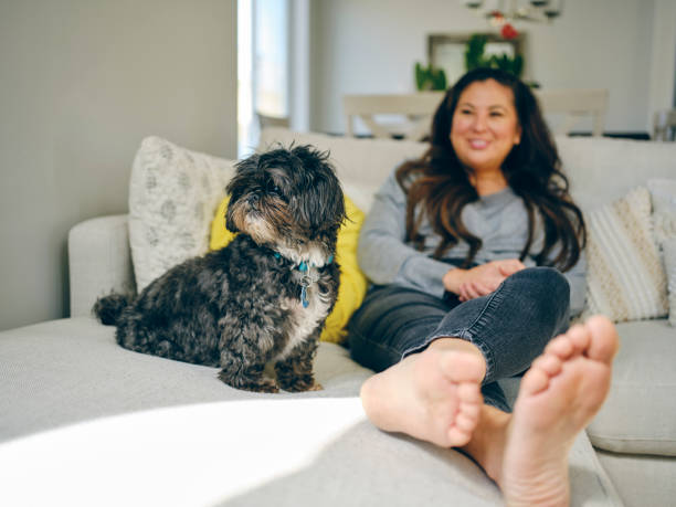 istock Woman at Home With Her Pet Dog 1389012698