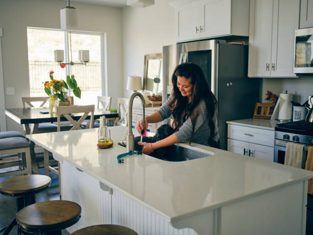 istock Woman at Home With Her Pet Dog 1389012764
