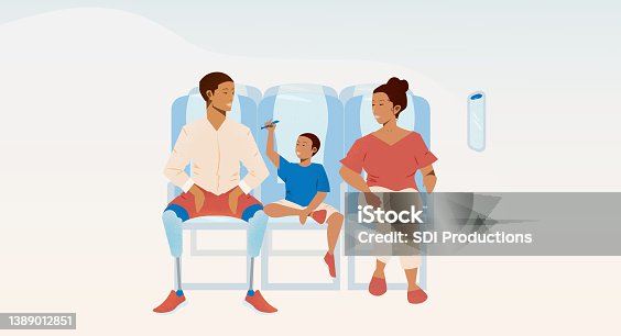istock Family traveling on airplane 1389012851