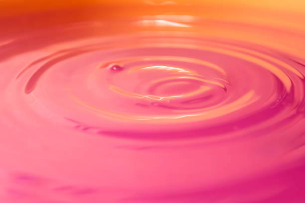 istock Pink strawberry cream illuminated with orange light. 1389015536