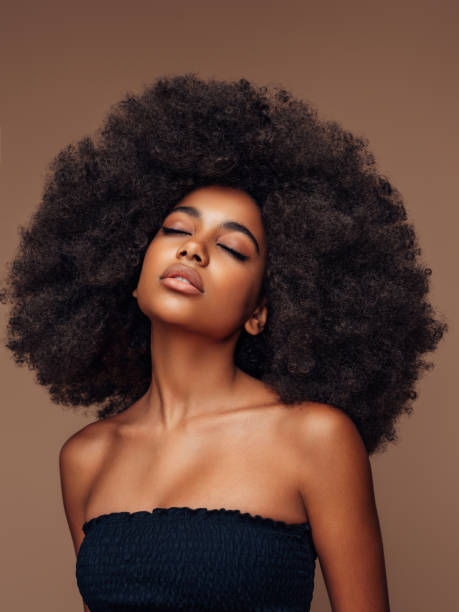 istock Beautiful girl with curly hairstyle 1389015714