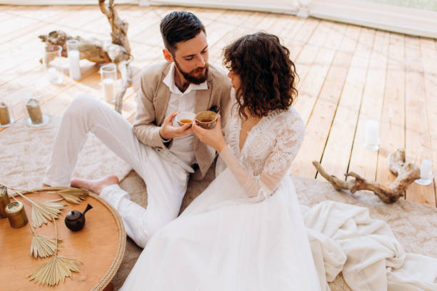 Tea ceremony at a boho wedding. Bride and groom in boho.